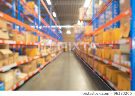 Blurry bokeh abstract background of interior of large warehouse retail store industry. Rack of furniture and home accessories stock storage. Interior of cargo in ecommerce and logistic concept. Depot 96383200