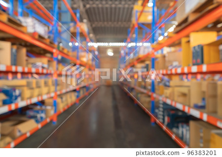 Blurry bokeh abstract background of interior of large warehouse retail store industry. Rack of furniture and home accessories stock storage. Interior of cargo in ecommerce and logistic concept. Depot 96383201