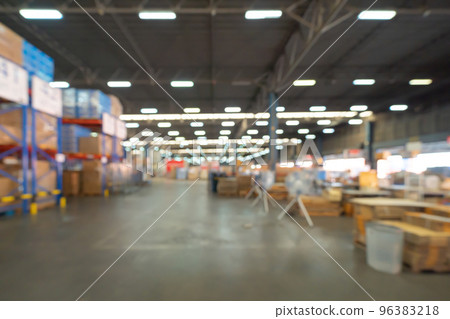 Blurry bokeh abstract background of interior of large warehouse retail store industry. Rack of furniture and home accessories stock storage. Interior of cargo in ecommerce and logistic concept. Depot Blurry bokeh abstract background of interior of large warehouse retail store industry. Rack of furniture and home accessories stock storage. Interior of cargo in ecommerce and logistic concept. Depot 96383218
