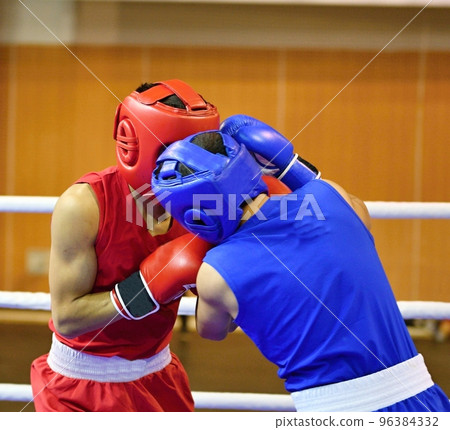 Boys fighter compete in boxing 96384332
