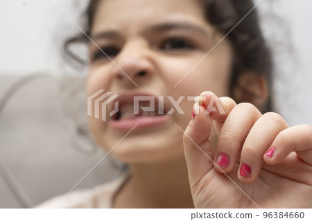 Little girl showing her first missing milk-tooth 96384660