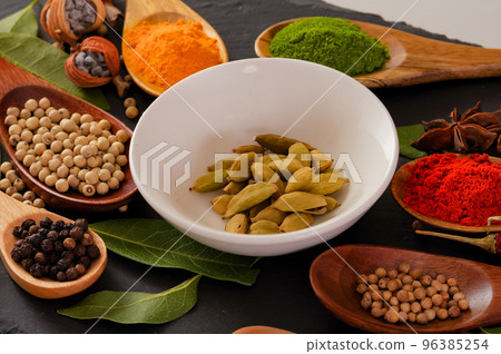 A lot of cardamom on a small plate 96385254