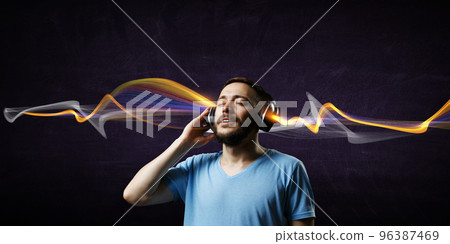 Young man with headphones . Mixed media Young man with headphones . Mixed media 96387469