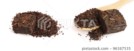 Round flat disc of puer tea isolated on white background. Pressed Chinese fermented Pu-erh tea 96387535