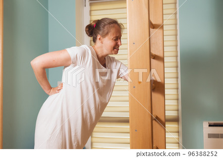 Pregnant woman trying to breath to soothe the pain of her labor contractions 96388252