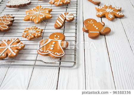 Gingerbread cookies on the white wooden table Gingerbread cookies on the white wooden table 96388336