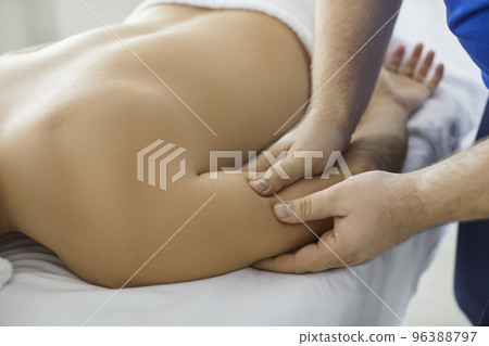 Therapist massage patient arm relieving pain 96388797