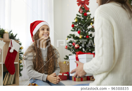 A Christmas gift in a box on Christmas day. Celebrating the New Year with your family. A Christmas gift in a box on Christmas day. Celebrating the New Year with your family. 96388835