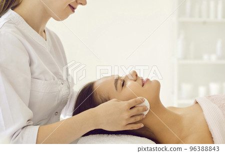 Beautician make face procedures for woman client 96388843
