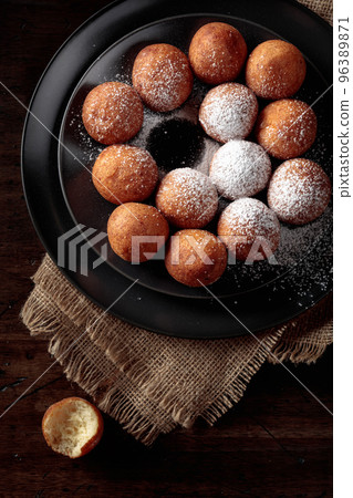 Balls of freshly baked homemade cottage cheese doughnuts. 96389871