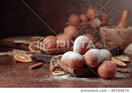 Cottage cheese doughnuts sprinkled with sugar powder. Cottage cheese doughnuts sprinkled with sugar powder. 96389874