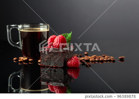 Chocolate cake with fresh raspberries and black coffee. Chocolate cake with fresh raspberries and black coffee. 96389878