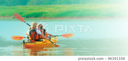 The Kayaking and canoeing with family. 96391108
