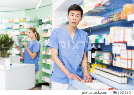 specialist is attentively looking medicines in lockers specialist is attentively looking medicines in lockers 96392120