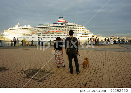 People sees off a cruise ship. Cruise ship Asuka II at sunset 96392460