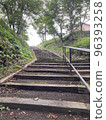 A curving staircase surrounded by bamboo grass 96393258