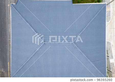 Aerial view of construction site roofing the house, Aerial view of roof work done on a home, Top view from drone camera Aerial view of construction site roofing the house, Aerial view of roof work done on a home, Top view from drone camera 96393260