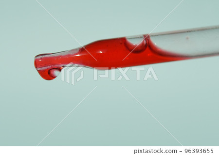 The last drop in the pipette of blood. The concept of developing a pharmaceutical drug for the treatment of diseases with the help of drugs that improve DNA. High quality photo 96393655