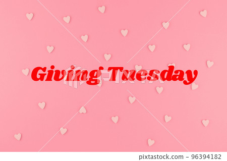 Giving Tuesday concept on pink background 96394182