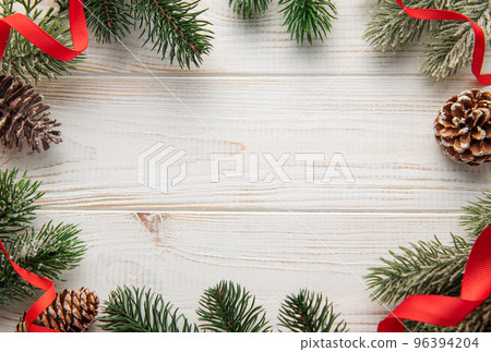 Christmas decoration with red ribbon making a frame with copy space. Christmas decoration with red ribbon making a frame with copy space. 96394204