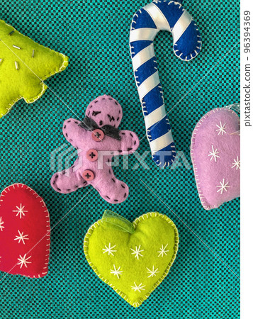 colorful Christmas ornaments on green colorful Christmas ornaments on green 96394369