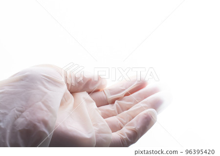 Putting on sterile latex protective gloves on hands for protection Putting on sterile latex protective gloves on hands for protection 96395420
