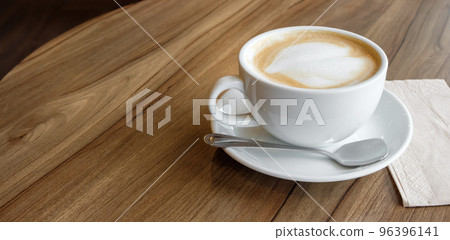 closed-up of hot drink coffee in white mug on brown wood table closed-up of hot drink coffee in white mug on brown wood table 96396141