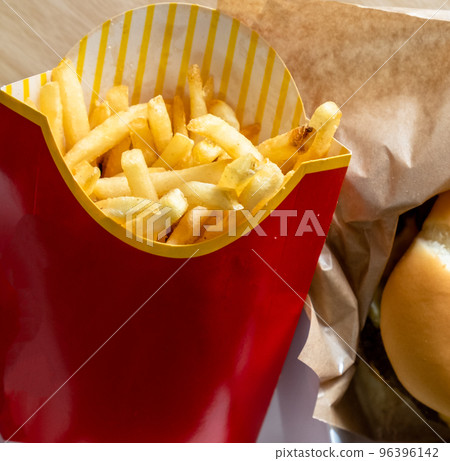 french fried chips in paper wrapper french fried chips in paper wrapper 96396142
