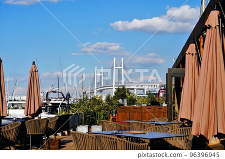 Seaside restaurant terrace seats and bay bridge 96396945