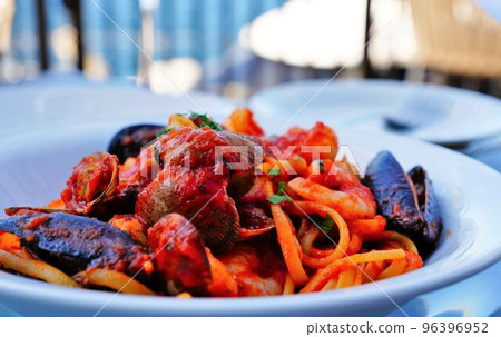 Pasta to eat on the terrace of a seaside restaurant Pasta to eat on the terrace of a seaside restaurant 96396952