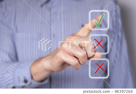 Man ticking right answer at digital screen with check mark. Businessman taking examination, survey, voting. Questionnaire, quiz. Electronic checkbox Man ticking right answer at digital screen with check mark. Businessman taking examination, survey, voting. Questionnaire, quiz. Electronic checkbox 96397268
