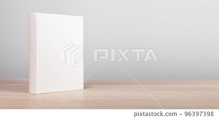 Banner with book mockup standing at wooden table. Novel, encyclopedia, code template with empty cover. Reading leisure, education, learning new information concept. Copy space Banner with book mockup standing at wooden table. Novel, encyclopedia, code template with empty cover. Reading leisure, education, learning new information concept. Copy space 96397398