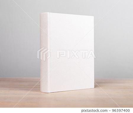 Book mockup standing at wooden table. Novel, encyclopedia, code template with blank cover. Reading leisure, education, learning new information concept Book mockup standing at wooden table. Novel, encyclopedia, code template with blank cover. Reading leisure, education, learning new information concept 96397400