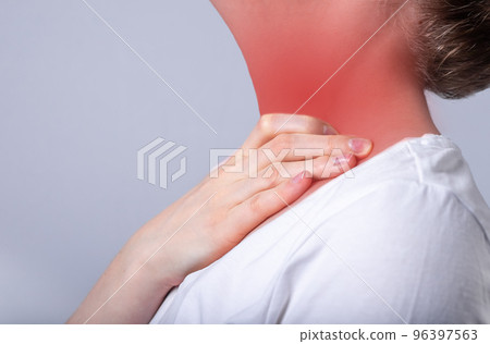 Woman suffering from sore throat. Hand touching neck with red spot closeup. Health care, illness concept. Flu, cold, inflammation. 96397563