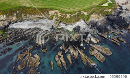 Rocks on the Irish littoral, top view. The shore of the Atlantic Ocean. Nature of Northern Europe. Rocky coastline. View from above. 96399396