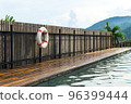 White-red lifebuoy hanging on the wall near pool in Chiang Mai, Thailand 96399444