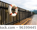 White-red lifebuoy hanging on the wall near pool in Chiang Mai, Thailand 96399445