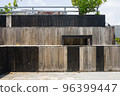 empty wooden benches on the roof of a cafe building 96399447