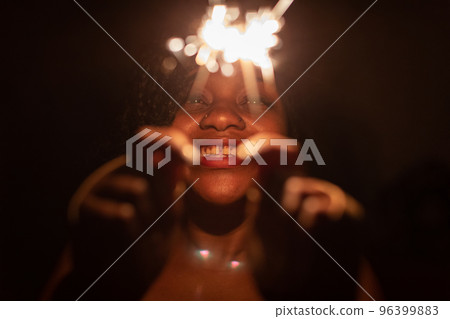 Unusual cold fires and bake a dark-skinned girl on New Year's Eve. 96399883