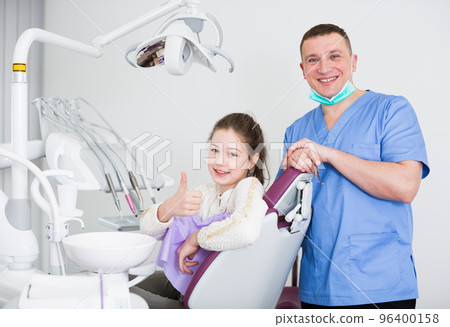 Male dentist with satisfied girl Male dentist with satisfied girl 96400158