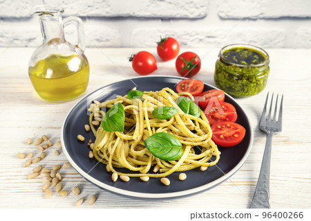 Pasta with fresh homemade pesto sauce and food ingredients Pasta with fresh homemade pesto sauce and food ingredients 96400266