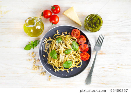 Pasta with fresh homemade pesto sauce and food ingredients Pasta with fresh homemade pesto sauce and food ingredients 96400267