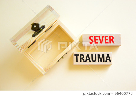 Sever trauma symbol. Concept words Sever trauma on wooden blocks. Beautiful white table white background. Empthy wooden chest. Psychological and sever trauma concept. Copy space. 96400773