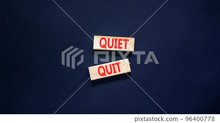 Quiet quit symbol. Concept words Quiet quit on wooden blocks. Beautiful black table black background. Business and quiet quit concept. Copy space. Quiet quit symbol. Concept words Quiet quit on wooden blocks. Beautiful black table black background. Business and quiet quit concept. Copy space. 96400778