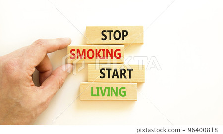 Stop smoking start living symbol. Concept words Stop smoking start living on cubes. Beautiful white background. Doctor hand. Medical healthy lifestyle stop smoking start living concept. Copy space. 96400818