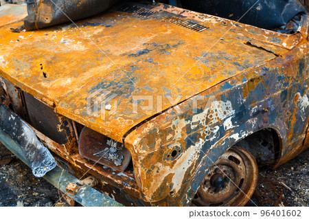 Burnt car. Traces of Russian shelling and fire. 96401602