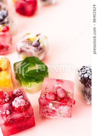 Frozen ice cubes with various berries 96401624