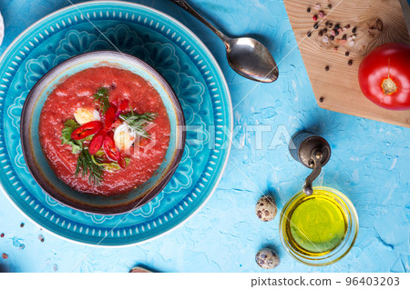 classic spanish raw eating cold soup Gazpacho served at blue table. flat lay. food recipe. healthy concept. classic spanish raw eating cold soup Gazpacho served at blue table. flat lay. food recipe. healthy concept. 96403203