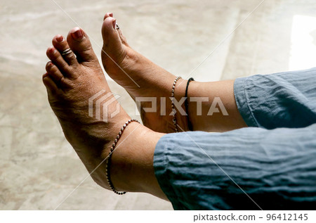 Closeup of an Indian woman's rough bare feet. Selective focus 96412145