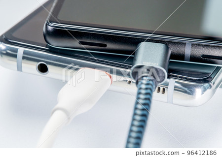 Scene close-up charging a smartphone 96412186